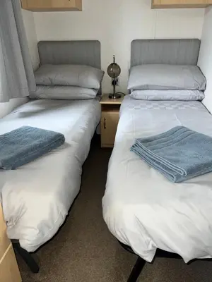 two beds sitting next to each other in a room at Seaside Getaway - Lytham Road in Warton