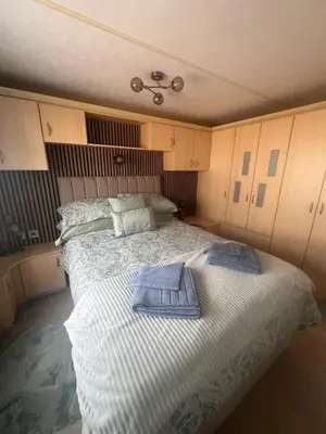 a bedroom with two beds with towels on it at Seaside Getaway - Lytham Road in Warton