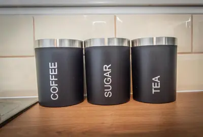 two black cups sitting on top of a table at Swindon Home in Liverpool