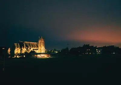 a building with a clock tower at night at Nine Yards Bell Tents - Lytham in Lytham St Annes