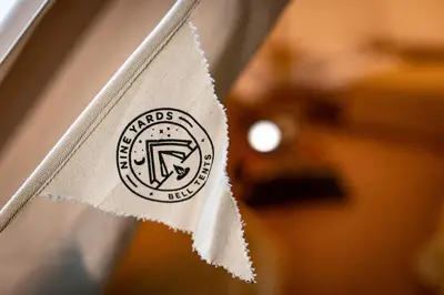 a paper napkin with a logo on it at Nine Yards Bell Tents - Lytham in Lytham St Annes