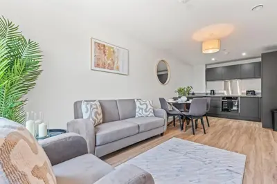 a living room with a couch and a table at Elegance Suite 2Bed 2BR Contractors Central in Liverpool