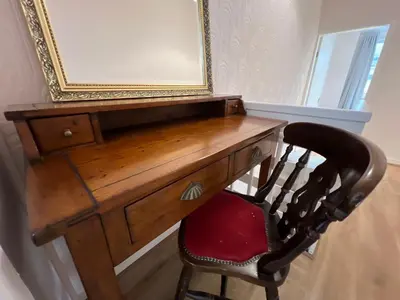 a wooden desk with a chair and a mirror at Liverpool Rose House Stylish 3 Bed Near Anfield and Goodison Park in Liverpool