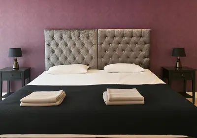 a bedroom with a large bed with two towels on it at The Vault Liverpool City Centre sleeps 4 in Liverpool