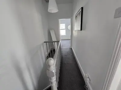a hallway with a stairway with a stair case at Room 3 Shared house in Kensington in Liverpool