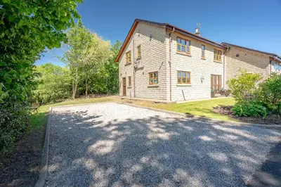 an empty driveway in front of a house at Pendle View Gatehouse Lakeside Stay in Pendleton