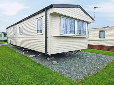 a mobile home is parked in a yard at Waterlily in Lancaster