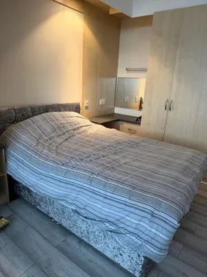 a bedroom with a large bed in a room at Lynton apartments in Blackpool