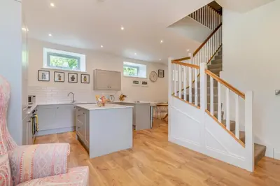 a kitchen with a staircase and a living room at 3 Bed in West Bradford oc-g32102 in West Bradford