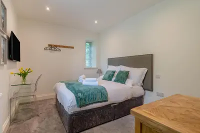 a bedroom with a bed with a teddy bear on it at 3 Bed in West Bradford oc-g32102 in West Bradford