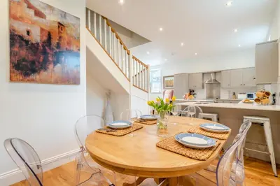 a kitchen and dining room with a wooden table and chairs at 3 Bed in West Bradford oc-g32102 in West Bradford