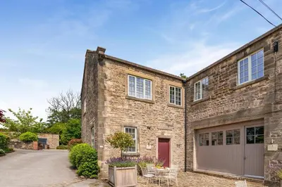 an exterior view of a brick house with a garage at 3 Bed in West Bradford oc-g32102 in West Bradford
