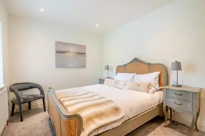 a bedroom with a bed with a chair and a desk at 2 Bed in West Bradford oc-c32101 in West Bradford