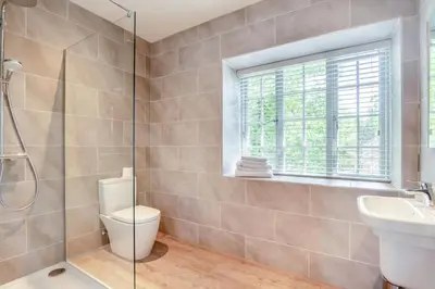 a bathroom with a toilet and a sink and a window at 2 Bed in West Bradford oc-c32101 in West Bradford