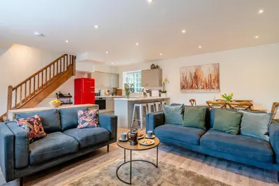 a living room with two blue couches and a table at 2 Bed in West Bradford oc-c32101 in West Bradford