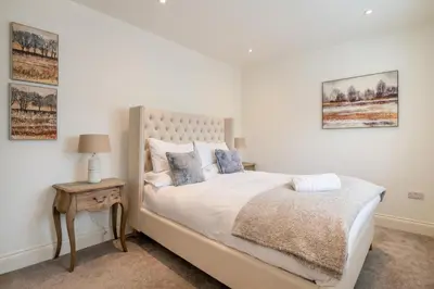 a bedroom with a bed and a table with a lamp at 2 Bed in West Bradford oc-c32101 in West Bradford