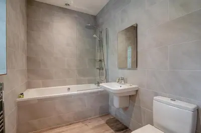a bathroom with a toilet and a sink and a bath tub at 1 Bed in West Bradford oc-g32100 in West Bradford