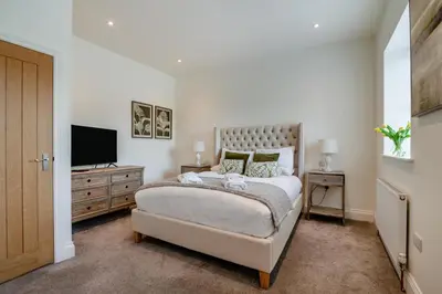 a bedroom with a bed and a flat screen tv at 1 Bed in West Bradford oc-g32100 in West Bradford