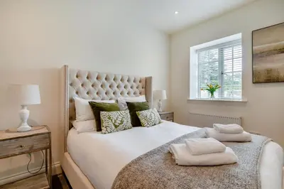 a bedroom with a large white bed and a window at 1 Bed in West Bradford oc-g32100 in West Bradford