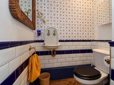 a bathroom with a toilet and a sink at Ismay Lounge Apartment- Titanic Interest in Liverpool