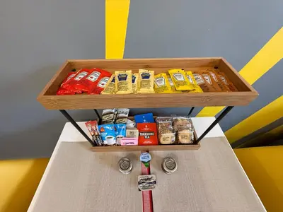a shelf with different types of food on a table at Anfield Courtyard Retreat in Liverpool