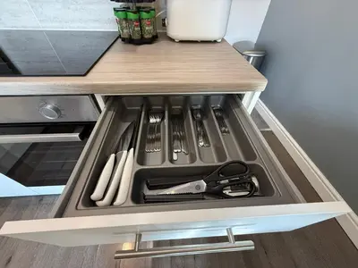 a drawer in a kitchen with utensils in it at Anfield Courtyard Retreat in Liverpool