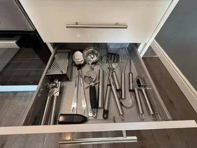 a drawer filled with utensils in a kitchen at Anfield Courtyard Retreat in Liverpool