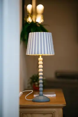 a lamp sitting on top of a table at The Carriage House at the Talbot in Lytham St Annes