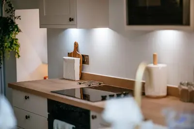 a kitchen with a counter top with a knife block at The Carriage House at the Talbot in Lytham St Annes