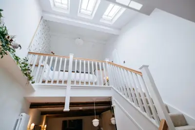 a staircase in a house with a crib at The Carriage House at the Talbot in Lytham St Annes