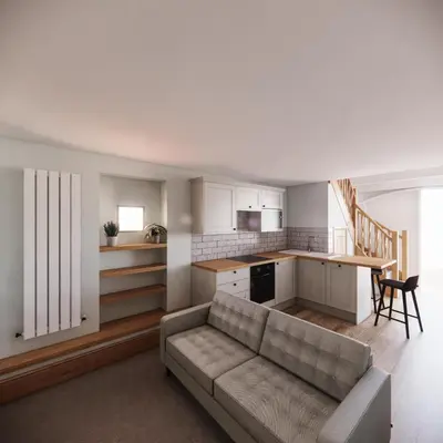 a living room with a couch and a kitchen at The Carriage House at the Talbot in Lytham St Annes