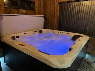 a large jacuzzi tub with blue water in it at Wayside Lodge in Blackpool
