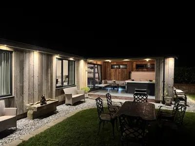 a patio with a table and chairs and a kitchen at Wayside Lodge in Blackpool
