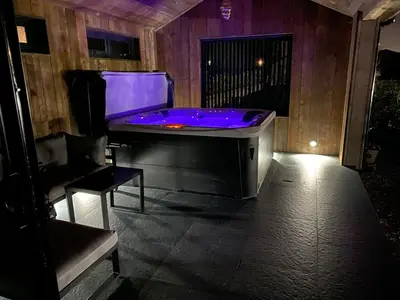 a jacuzzi tub with purple lighting in a room at Wayside Lodge in Blackpool