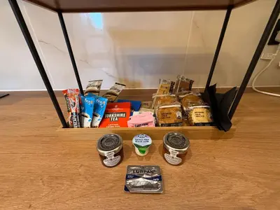 a shelf with different types of food on a table at The Anfield Nook in Liverpool