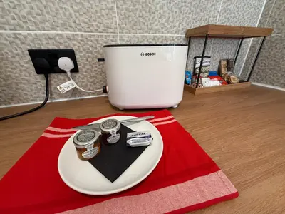 a plate with two watches on it on a red rug at The Anfield Loft in Liverpool