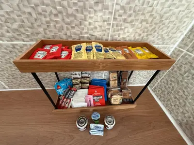 a wooden shelf with food and other items on it at The Anfield Loft in Liverpool