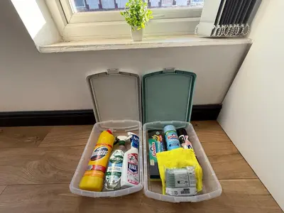 a plastic container filled with lots of cleaning products at The Anfield Loft in Liverpool