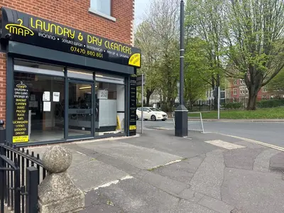 a store on the side of a street at 2 Bed Preston City Centre - Sleeps 4 with 1 Free Parking Space in Preston
