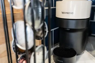 a coffee cup and a mixer on a shelf at Modern 4bedroom City Home Near LFC in Liverpool