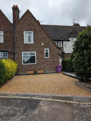 a brick house with a large driveway at Luxury 3 bed house with off road parking for 2 cars, garden, 10 minutes from city-centre in Liverpool