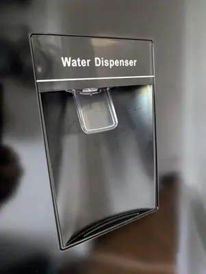 a water dispenser sitting on top of a table at Luxury 3 bed house with off road parking for 2 cars, garden, 10 minutes from city-centre in Liverpool