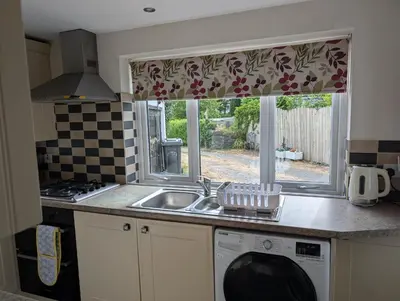 a kitchen with a sink and a window at Garth Nook Barn in Soutergate