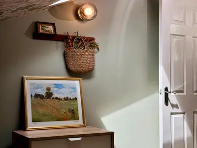 a painting on a wall with a basket on the wall at Aesthetic Architect designed Loft in City Centre in Liverpool