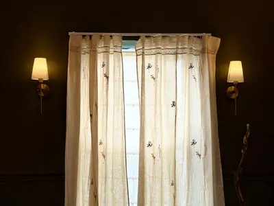 a window with curtains in a room with two lights at Aesthetic Architect designed Loft in City Centre in Liverpool