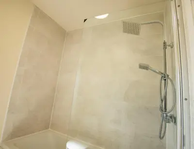a shower with a glass door in a bathroom at Luxury 5BDR with City Access, Free Parking and Wi-Fi in Ince-in-Makerfield