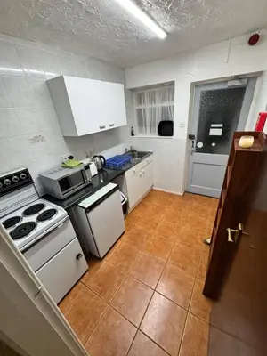 a kitchen with a stove and a counter top at Beachside Bliss In Blackpool 1 Bed Apartment in Blackpool