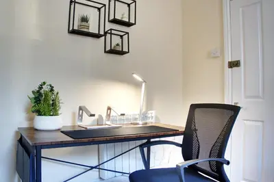 a desk with a sink and a chair at Signature Coastal Suites - Two Chic & Stylish Apartments by Parydise Properties in Morecambe