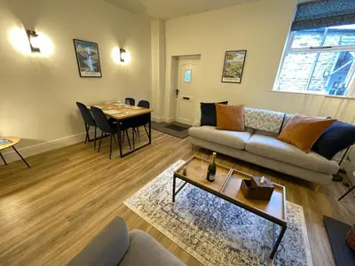 a living room with a couch and a table at 3 Chapel Square in Lancaster