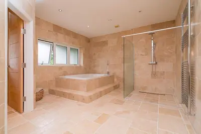 a large bathroom with a tub and a shower at The Luxury Country Home in Aughton